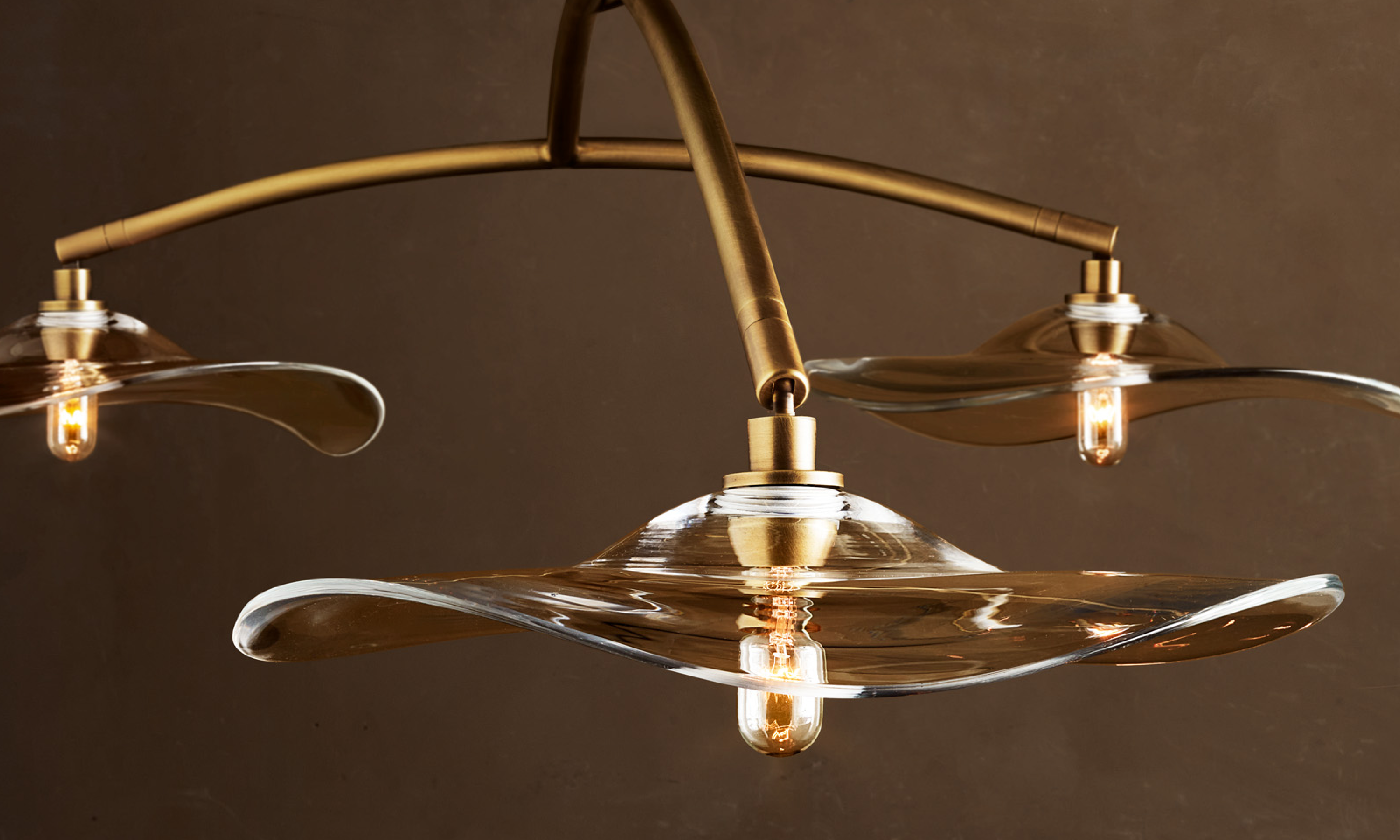 Closeup shot of John Pomp Lily Linear Chandelier